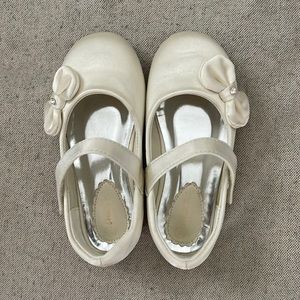 Toddler cream colored dress shoes.